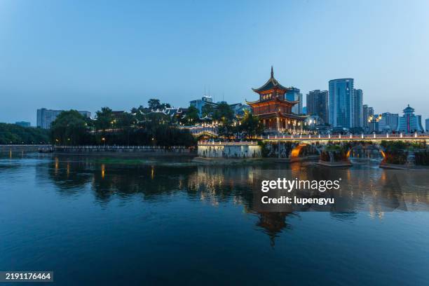 jiaxiu tower at dusk - guizhou province stock pictures, royalty-free photos & images