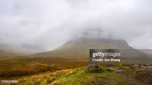 mountain peaks of scottish highlands under rain clouds in autumn - awe stock pictures, royalty-free photos & images