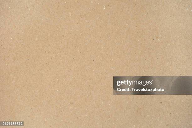brown paper texture background. recycle paper background. brown kraft paper. eco-conscious businesses and products background. start with a sheet of paper. start something from scratch. space for new creative ideas. diy paper background texture. - carta da pacchi foto e immagini stock
