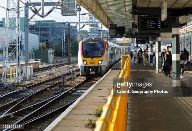 Greater Anglia class 720 Aventra train arriving at platform, Cambridge, Cambridgeshire, England, UK.