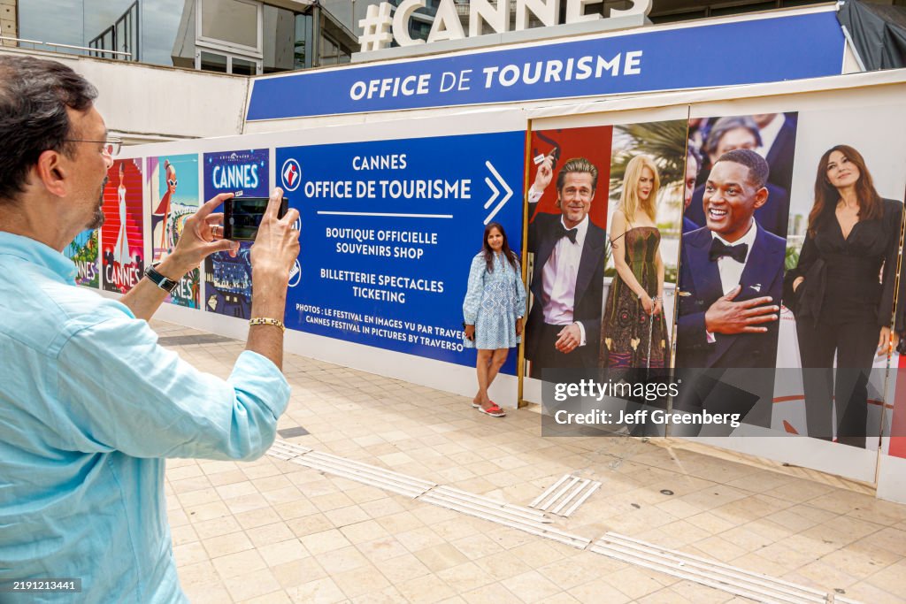 Cannes, France, Le Croisette, Palais des Festivals et des Congres, Cannes Film Festival Palace, Walk of Fame, giant posters, visitors posing with