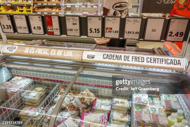 Barcelona, Spain, Catalonia, Carrer de Nicaragua Sants-Montjuic, Lidl discount supermarket, refrigerated case, sliced deli meats, cheese whole cooked...