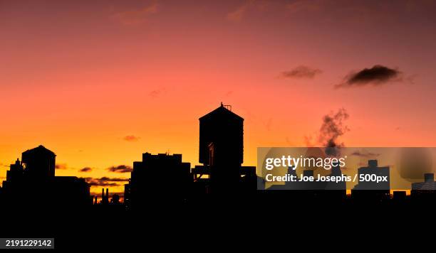 silhouette of buildings at sunset,new york city,new york,united states,usa - urban exploration stock pictures, royalty-free photos & images