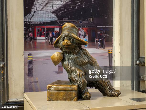 Bronze statue of Paddington Bear in Paddington station, London, UK.