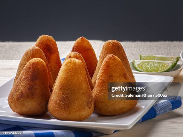 close-up of breads in plate on table - croquette stock pictures, royalty-free photos & images