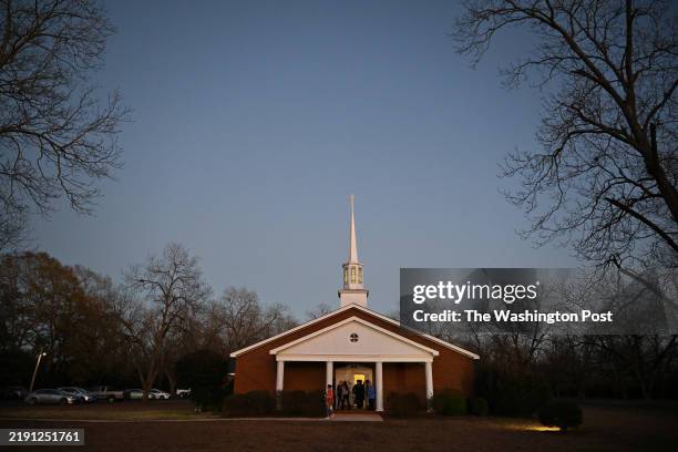 People are seen outside a prayer service for former President Jimmy Carter at Maranatha Baptist Church on Monday December 30, 2024 in Plains, GA. The...