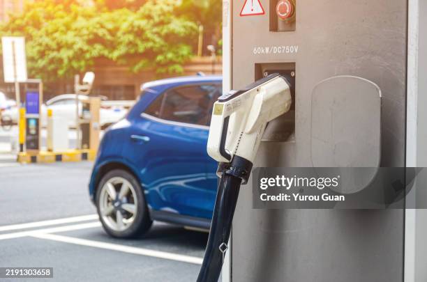 new energy vehicle charging station - hybrid car stock pictures, royalty-free photos & images