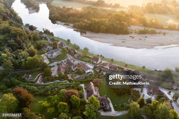 aerial view of apremont-sur-allier with its castle at sunrise and the allier river - burgundy france stock pictures, royalty-free photos & images
