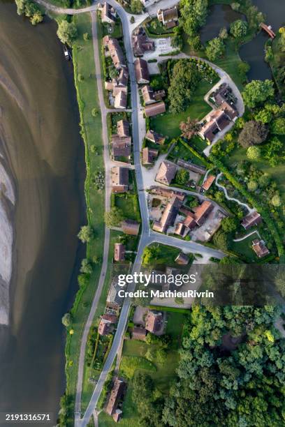 aerial view of apremont-sur-allier at sunrise with a misty atmosphere and the allier river - loire stock pictures, royalty-free photos & images