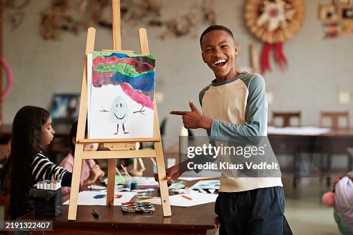 Happy boy pointing at painting Happy boy pointing at painting