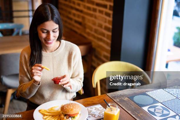 woman enjoying lunch - tomato sauce stock pictures, royalty-free photos & images