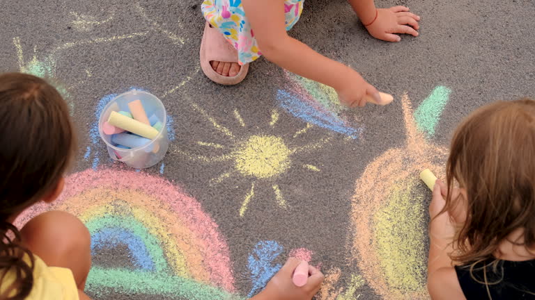 https://media.gettyimages.com/id/2191341844/video/children-draw-on-the-asphalt-with-chalk-selective-focus-kid.jpg?b=1&s=640x640&k=20&c=0p7zqSc3rFY9NbP7bO7Dwld_qdnHMUnMAgC3mr3Nssk=