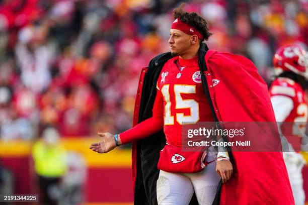 Patrick Mahomes of the Kansas City Chiefs looks on from the sideline during an NFL football game against the Houston Texans at GEHA Field at...