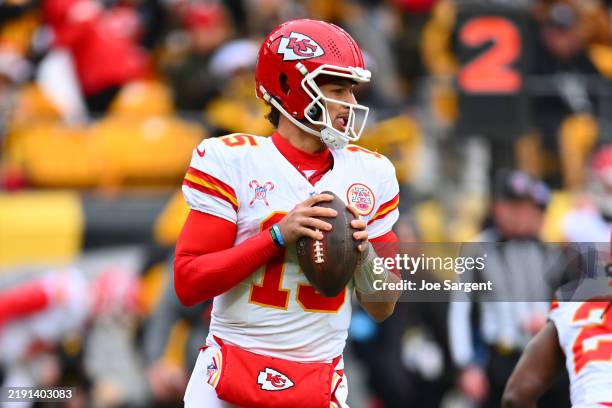 Patrick Mahomes of the Kansas City Chiefs steps back to a pass during the first quarter against the Pittsburgh Steelers at Acrisure Stadium on...