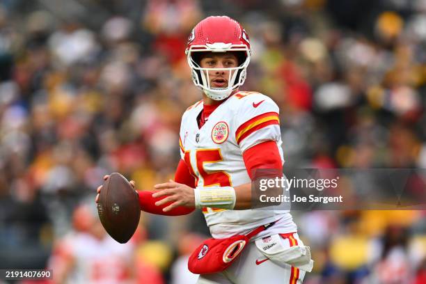 Patrick Mahomes of the Kansas City Chiefs steps back to pass during the fourth quarter against the Pittsburgh Steelers at Acrisure Stadium on...