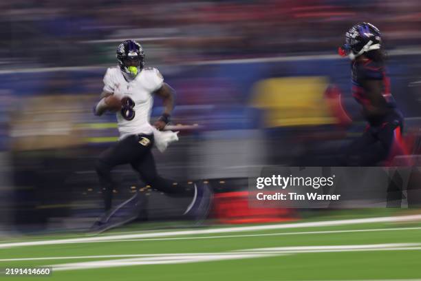 Lamar Jackson of the Baltimore Ravens runs the ball for a touchdown during the third quarter against the Houston Texans at NRG Stadium on December...