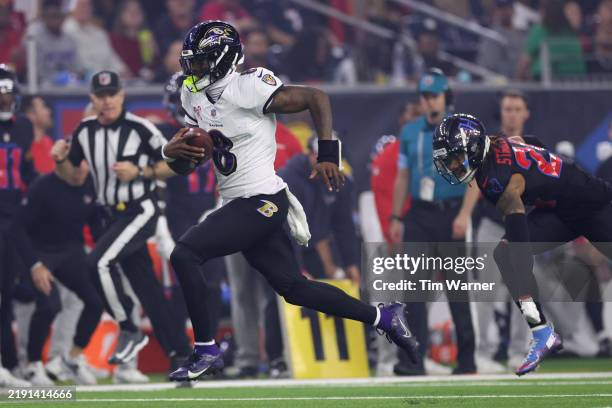 Lamar Jackson of the Baltimore Ravens runs the ball for a touchdown during the third quarter against the Houston Texans at NRG Stadium on December...