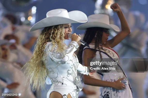 Beyoncé performs with daughter, Blue Ivy, during the halftime show for the game between the Baltimore Ravens and the Houston Texans at NRG Stadium on...