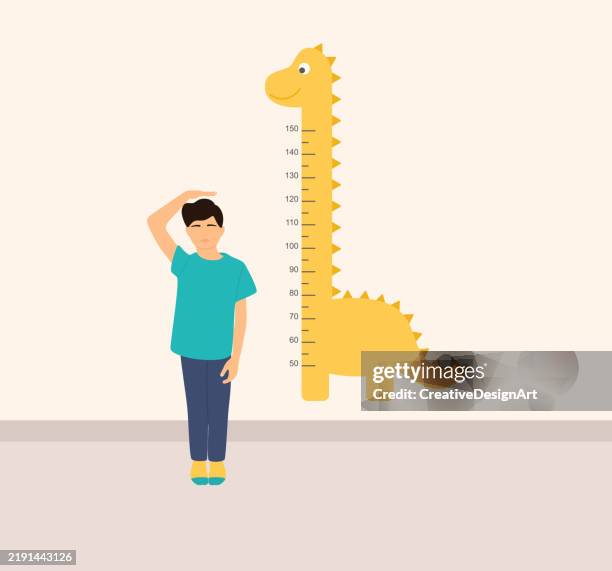 little boy measuring his height with dinosaur growth ruler - height chart stock illustrations