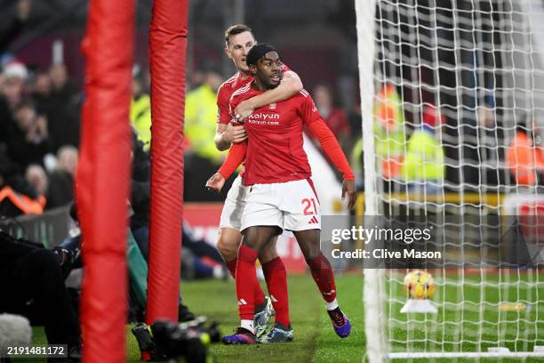Anthony Elanga of Nottingham Forest celebrates scoring his team's first goal with team mate Chris Wood during the Premier League match between...