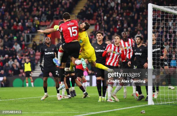 Lukasz Fabianski of West Ham United collides with Nathan Wood of Southampton as he attempts to punch the ball clear during the Premier League match...