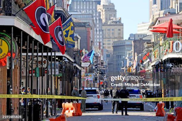 Law enforcement officers from multiple agencies work the scene on Bourbon Street after at least ten people were killed when a person allegedly drove...