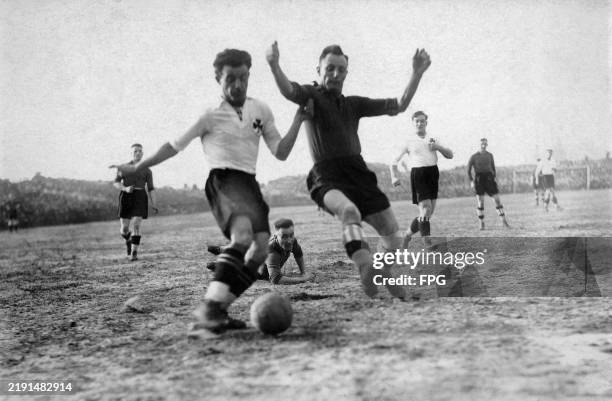 Greuther Furth footballer under pressure from an opposing player during a German football match, Germany, circa 1925.