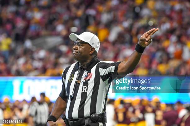 Referee Larry Smith signals first down during the Texas Longhorns versus Arizona State Sun Devils College Football Playoff Quarterfinal at the...