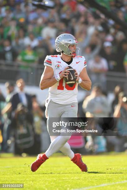 Quarterback Will Howard of the Ohio State Buckeyes drops back to pass during the Ohio State Buckeyes versus Oregon Ducks College Football Playoff...