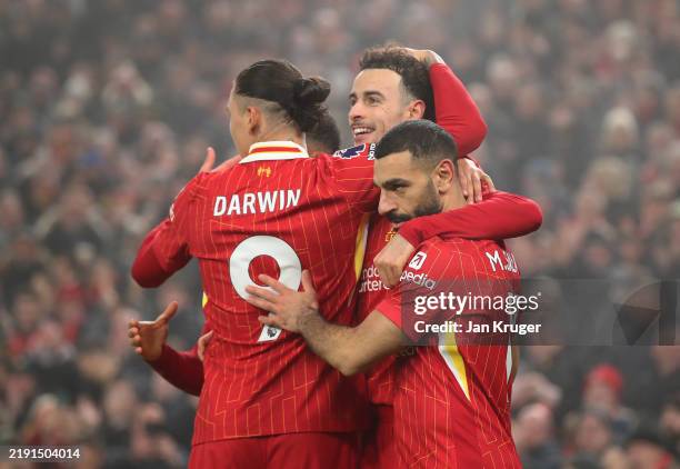 Curtis Jones of Liverpool celebrates scoring his team's second goal with teammates during the Premier League match between Liverpool FC and Leicester...