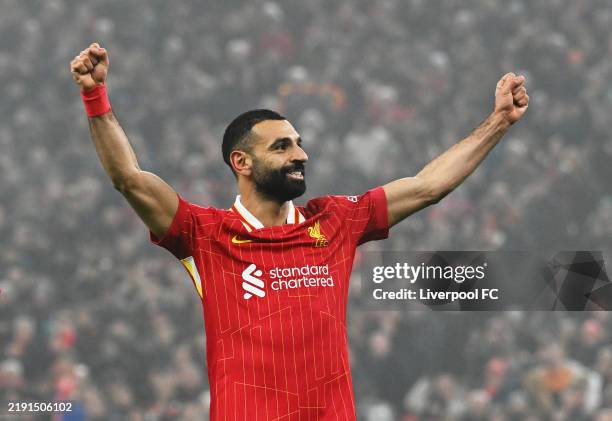 Mohamed Salah of Liverpool celebrates scoring his team's third goal during the Premier League match between Liverpool FC and Leicester City FC at...