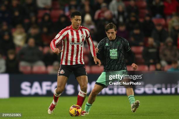 Sunderland's Jobe Bellingham is under pressure from Sheffield United's Sydie Peck during the Sky Bet Championship match between Sunderland and...