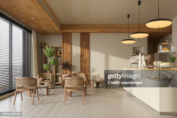 interno del caffè in stile wabi sabi con tavolini, sedie e lampade a sospensione - locale di ristoro foto e immagini stock