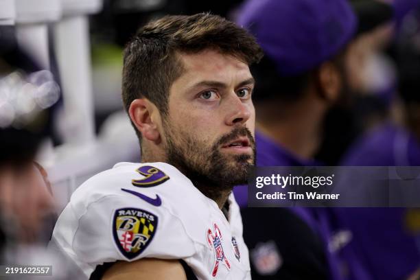 Justin Tucker of the Baltimore Ravens sits on the bench in the second half against the Houston Texans at NRG Stadium on December 25, 2024 in Houston,...