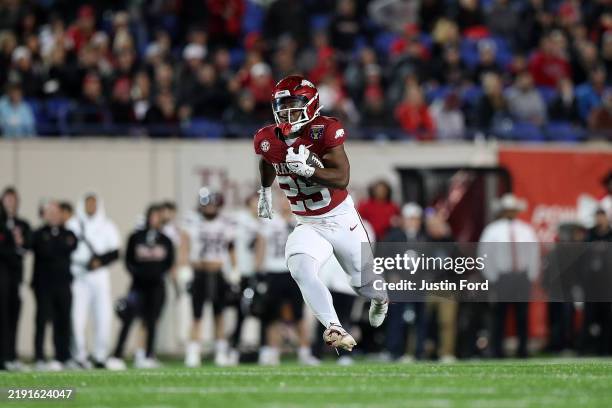 Tyrell Reed Jr. #29 of the Arkansas Razorbacks carries the ball during the second half of the AutoZone Liberty Bowl against the Texas Tech Red...