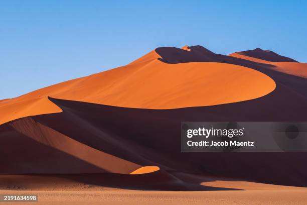 scenic view of desert against clear sky - sossusvlei stock pictures, royalty-free photos & images