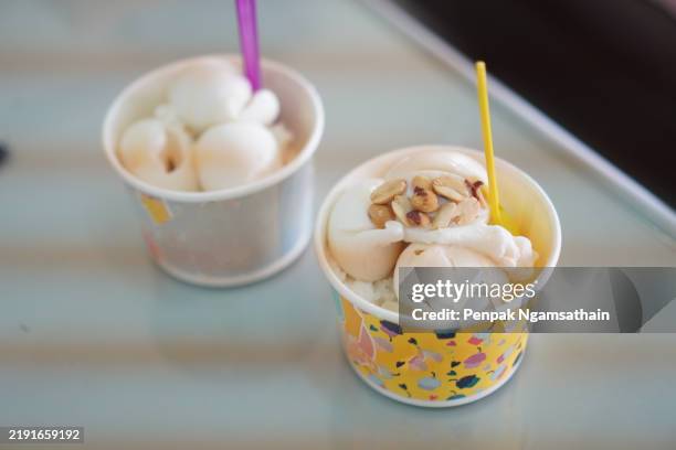 coconut milk ice cream in paper cup - homemade popsicle stock pictures, royalty-free photos & images