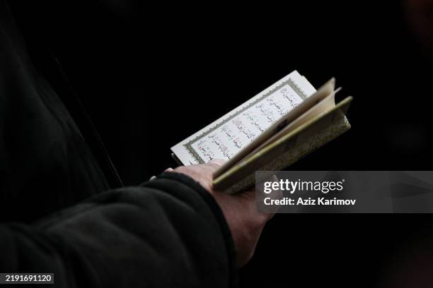 Religion read Quran during the funreal of Mahammadali Eganov, 13 who died in the Azerbaijan Airlines Embraer 190 crash near Kazakhstan's Aktau...