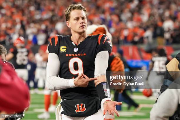 Joe Burrow of the Cincinnati Bengals celebrates after beating the Denver Broncos 30-24 in overtime at Paycor Stadium on December 28, 2024 in...
