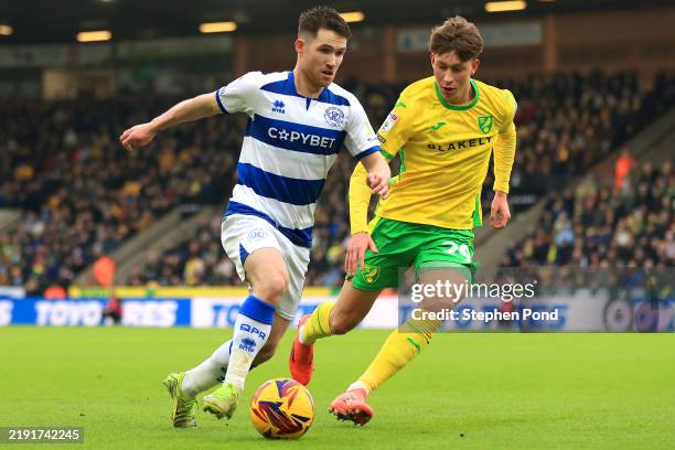 Paul Smyth of Queens Park Rangers and Oscar Schwartau of Norwich City battle for possession during the Sky Bet Championship match between Norwich...