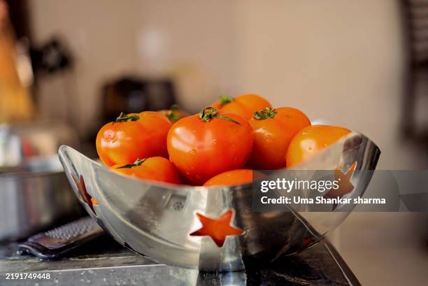 fresh tomatoes in a stylish star-patterned bowl - acetylcholine stock pictures, royalty-free photos & images