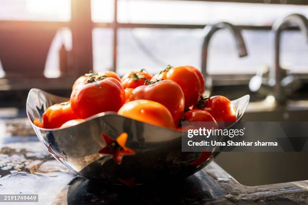 fresh tomatoes in a sunlit kitchen - acetylcholine stock pictures, royalty-free photos & images
