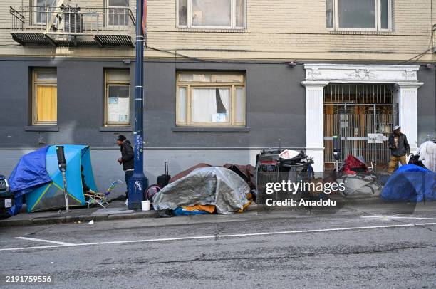 Homeless encampments are seen on a sidewalk in Tenderloin district of San Francisco, California, United States on January 3, 2025.