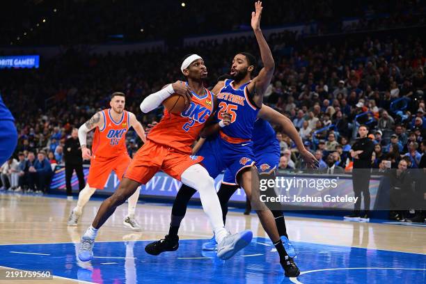 Shai Gilgeous-Alexander of the Oklahoma City Thunder attempts to drive past Mikal Bridges of the New York Knicks during the first half at Paycom...