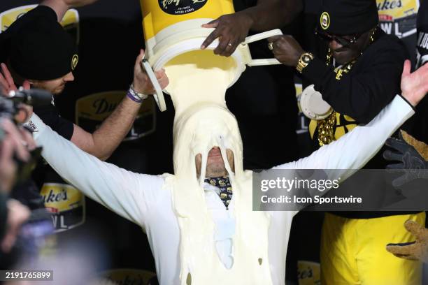Minnesota Golden Gophers head coach P.J. Fleck gets doused with Duke's Mayonnaise as part of the winners celebration during the Duke Mayo Bowl...