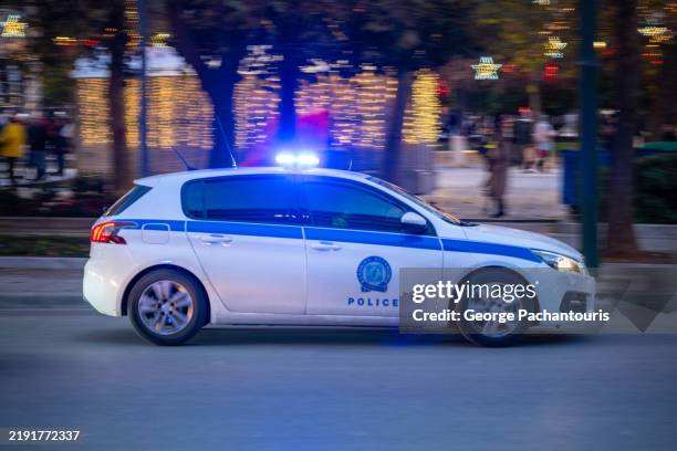 greek police car moving - car blinker stock pictures, royalty-free photos & images