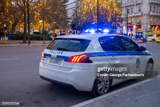 stationary greek police car - car blinker stock pictures, royalty-free photos & images