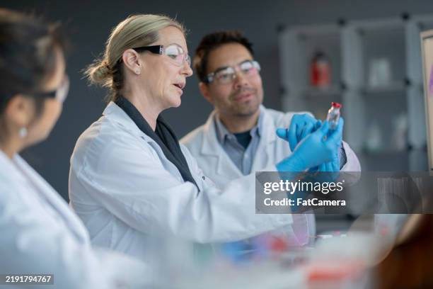 working on vaccines - research stock pictures, royalty-free photos & images
