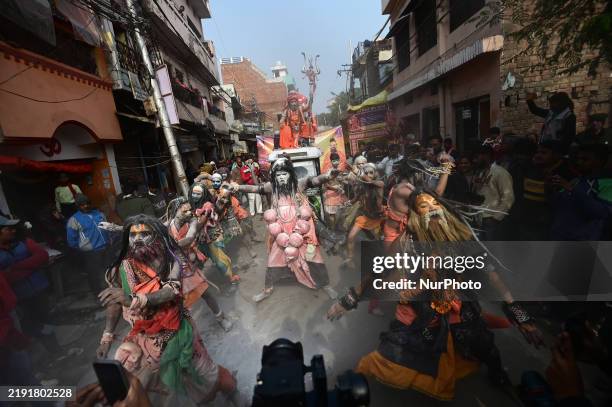 Artists perform during a religious procession towards the Sangam, the confluence of rivers Ganges and Yamuna, during the first entry for the...