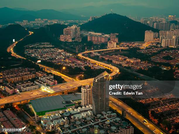 drone view directly above night scene city with elevated road bridges cross junction - flat topped hill stock pictures, royalty-free photos & images